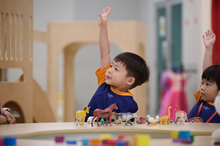 Kid raising his hand
